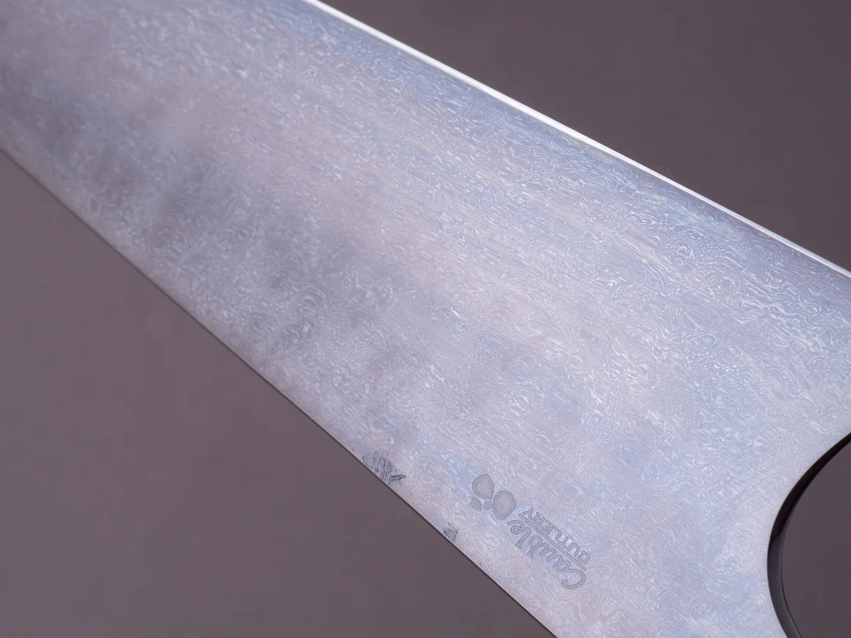 Caublestone Cutlery - In-House Watered Wootz - Stone Polished w/ Forced Patina - Gyuto 240mm - Stabilized Bog Oak Handle w/ Trimascus Spacer