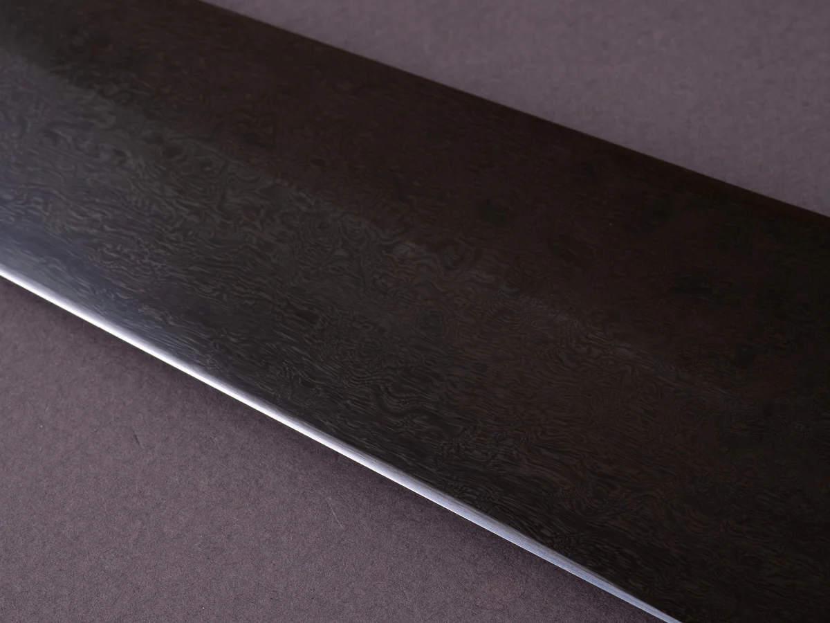 Caublestone Cutlery - In-House Watered Wootz - Stone Polished w/ Forced Patina - Gyuto 240mm - Stabilized Bog Oak Handle w/ Trimascus Spacer - Image 4