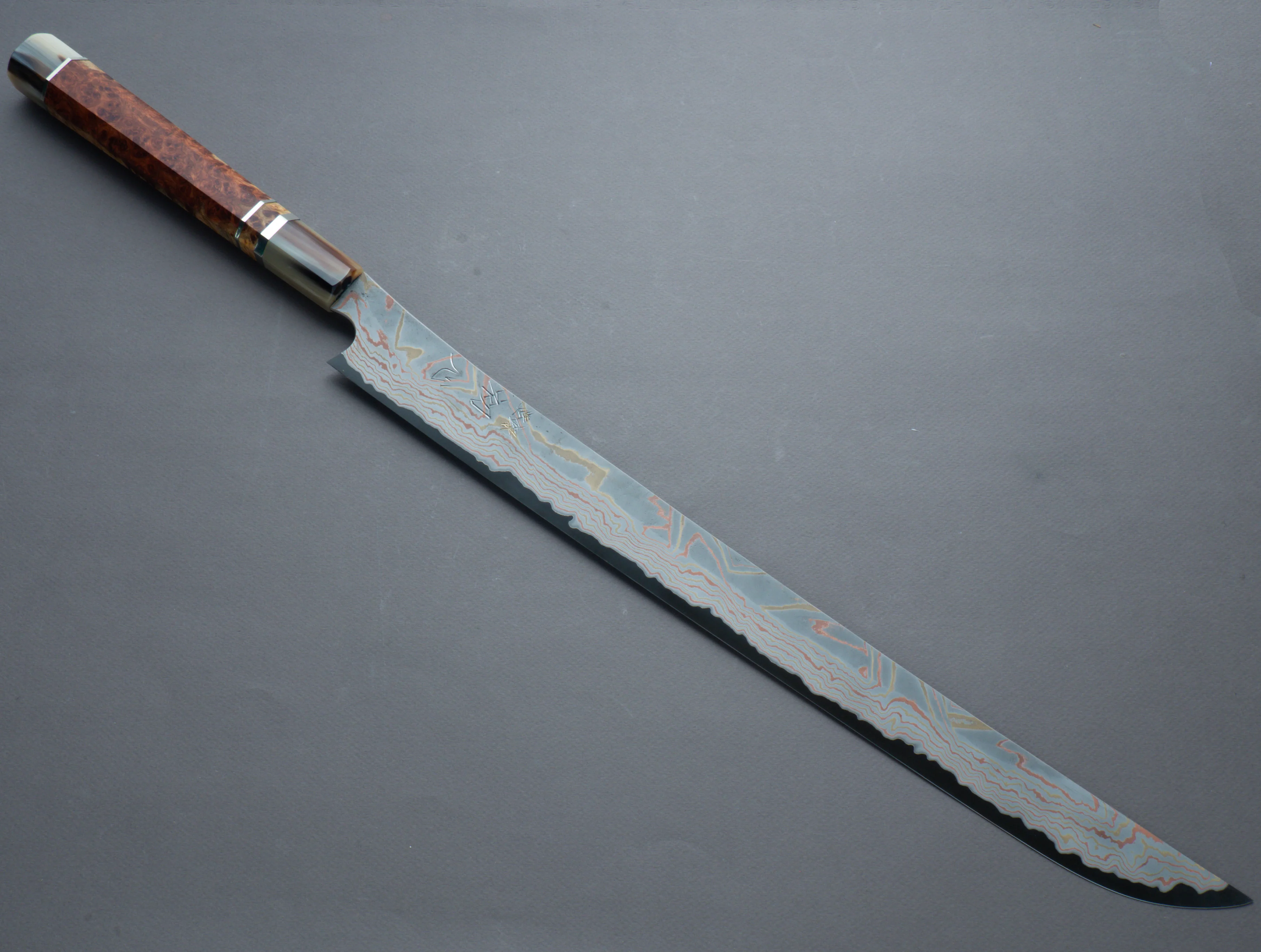 Nigara Hamono - Kurozome Rainbow Damascus - Blue #2 Forced Patina - 450mm Saber Sujihiki - Karin Burl Handle - Custom Sandalwood Saya - Image 2