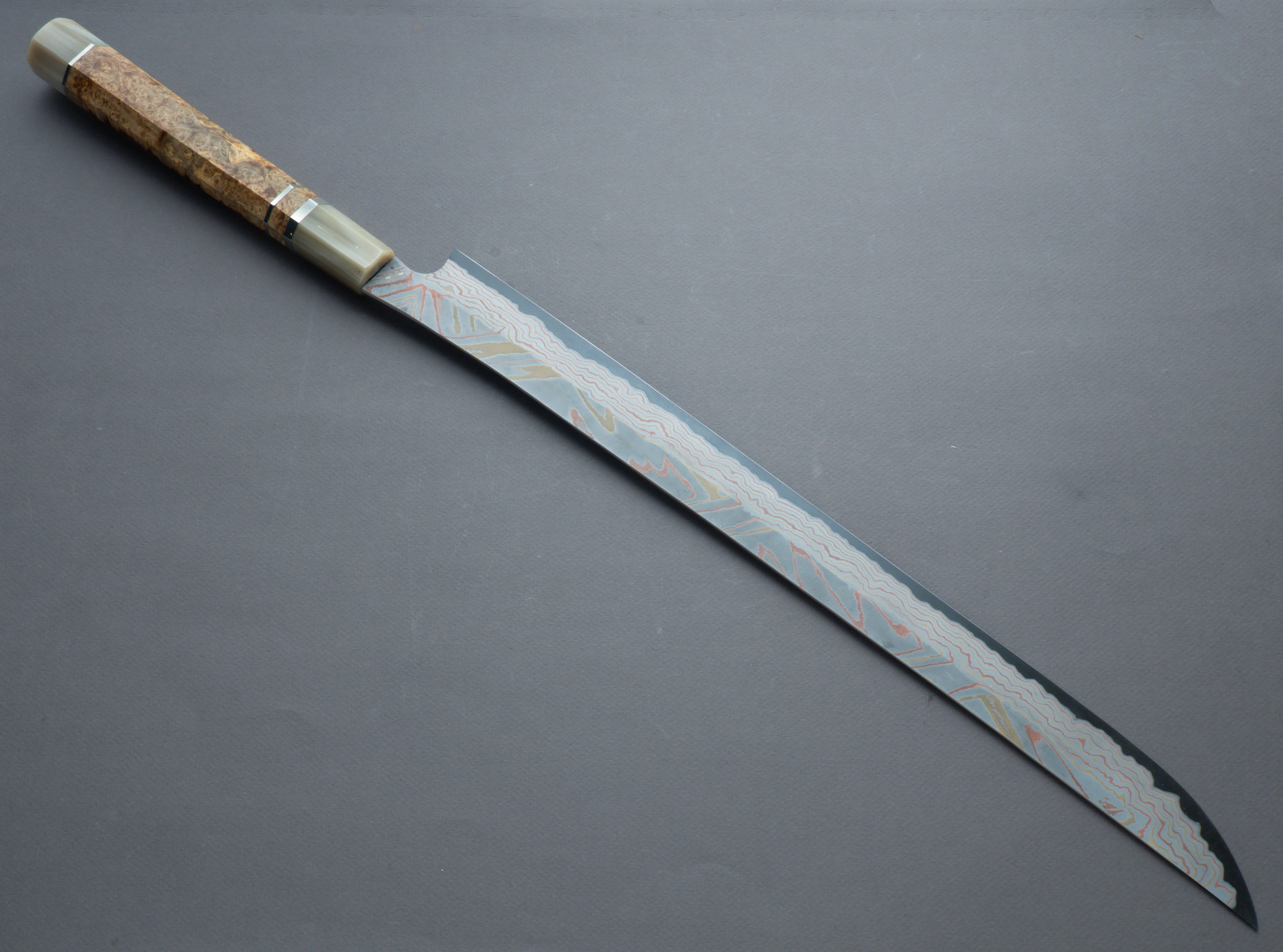 Nigara Hamono - Kurozome Rainbow Damascus - Blue #2 Forced Patina - 450mm Saber Sujihiki - Karin Burl Handle - Custom Sandalwood Saya - Image 3
